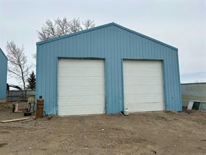  IMMEDIATE POSSESION- 2 SHOPS-2.42 ACRES ON PAVED RR-150 - 4 KILOMETERS west of Brooks. 1-Shop is...