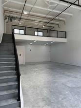 Mid construction with mezzanine and stairs in