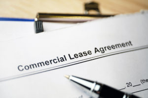 Pen sitting on a commercial lease agreement